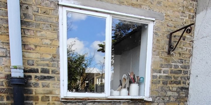 BLACK TIMBER SINGLE DOOR & CASEMENT WINDOW photo